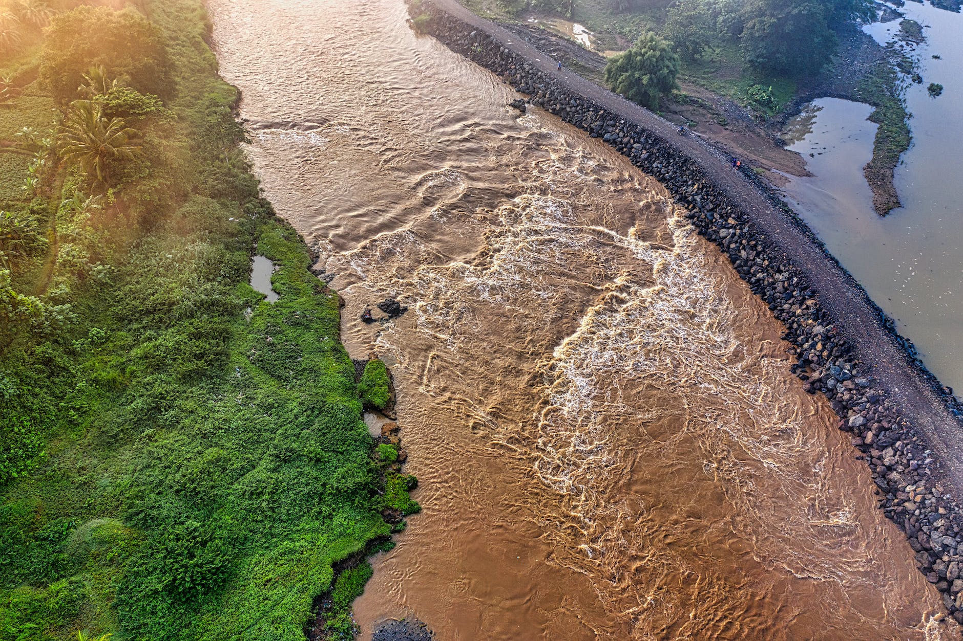 aerial view of a river near grassland